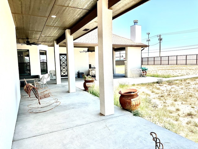 view of patio with visible vents and a ceiling fan