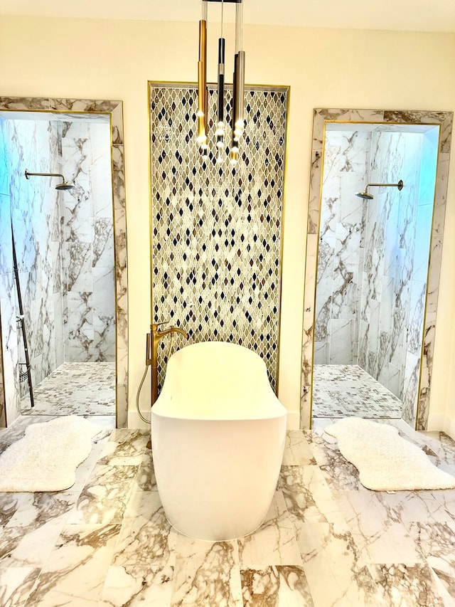 bathroom with a marble finish shower, a soaking tub, and marble finish floor