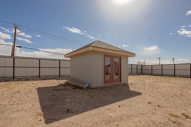 view of outdoor structure with an outbuilding and a fenced backyard