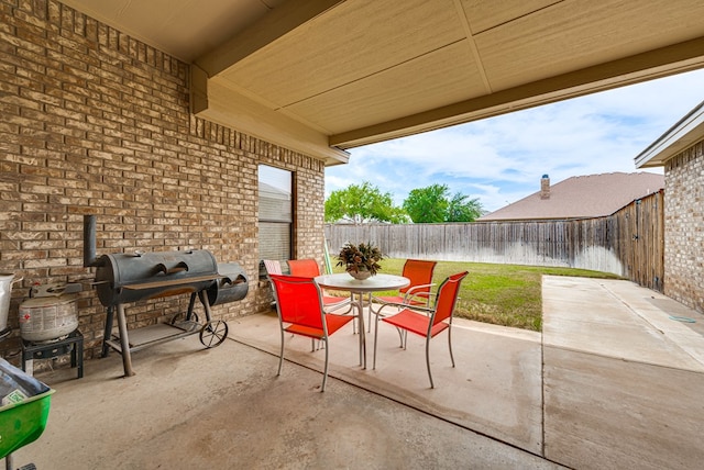 view of patio with a grill