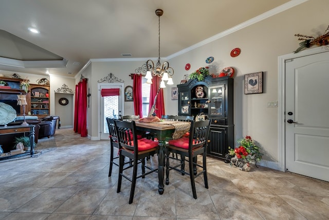 dining area with a notable chandelier and ornamental molding