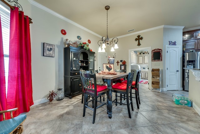 dining area with a chandelier and crown molding