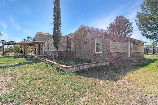 view of property exterior with a lawn