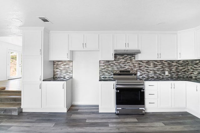 kitchen featuring electric stove, dark wood-type flooring, a textured ceiling, white cabinets, and decorative backsplash