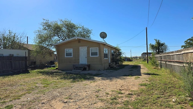 back of house with a yard