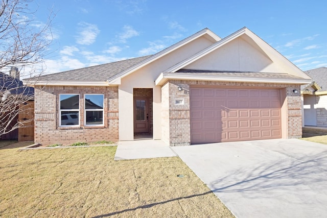 single story home featuring a garage and a front yard