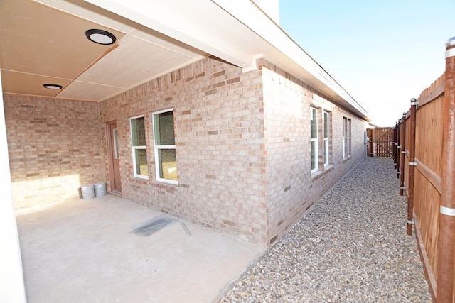 view of property exterior with a patio