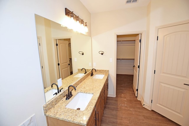 bathroom featuring hardwood / wood-style floors and vanity