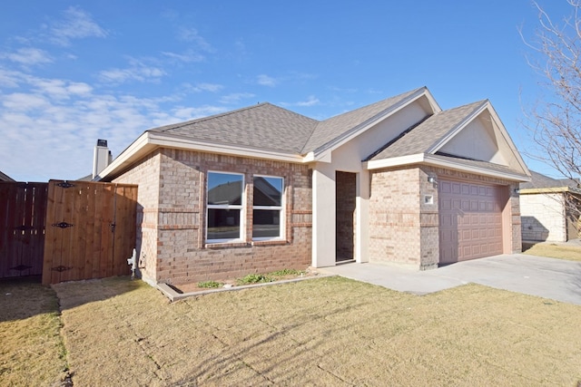 ranch-style house featuring a front yard and a garage