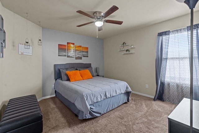 bedroom featuring a ceiling fan, baseboards, and carpet floors