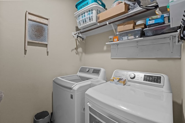 laundry area featuring laundry area and separate washer and dryer