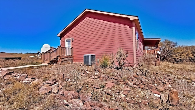 view of side of property featuring cooling unit