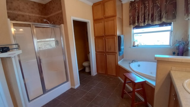 full bathroom with vanity, tile patterned flooring, toilet, ornamental molding, and independent shower and bath