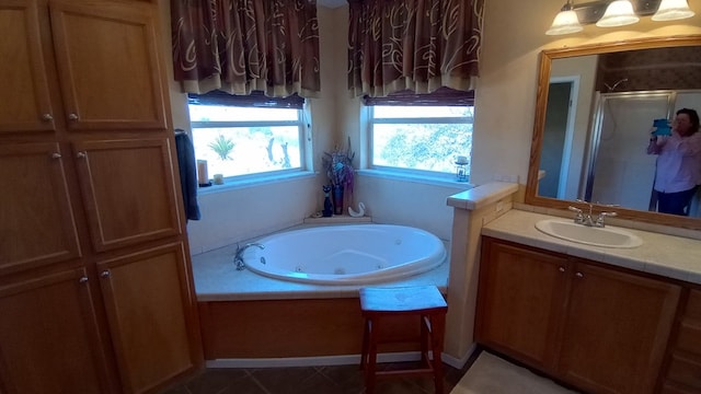 bathroom with shower with separate bathtub and vanity