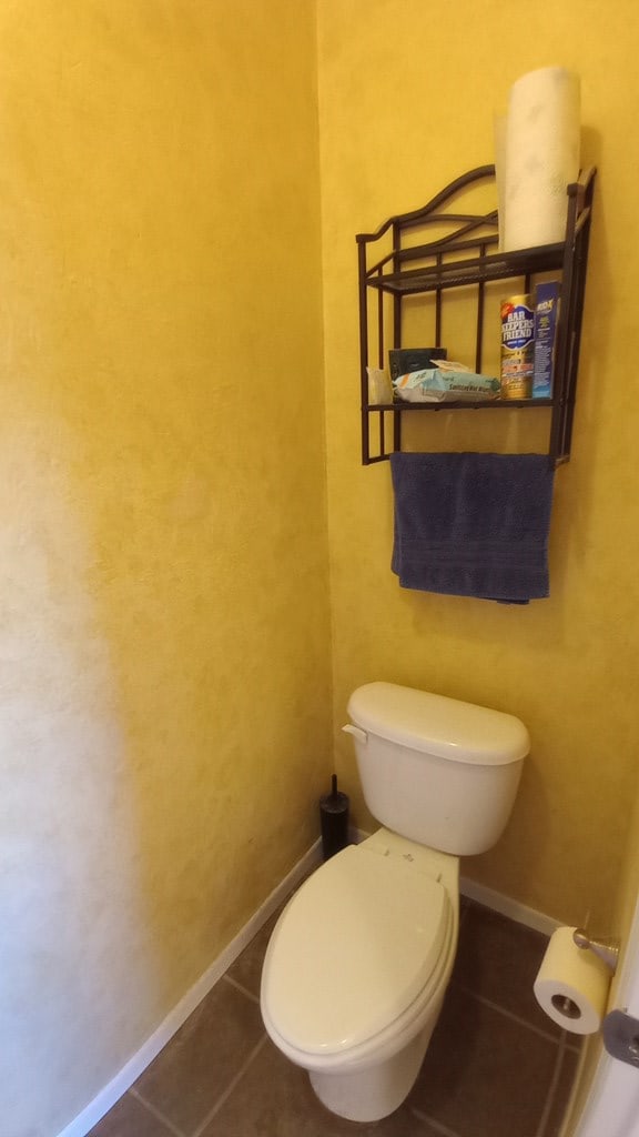 bathroom with tile patterned flooring and toilet