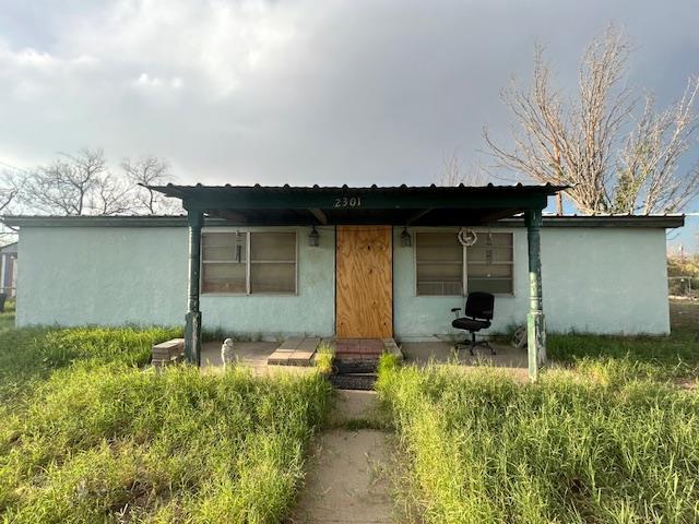 rear view of house featuring a patio area