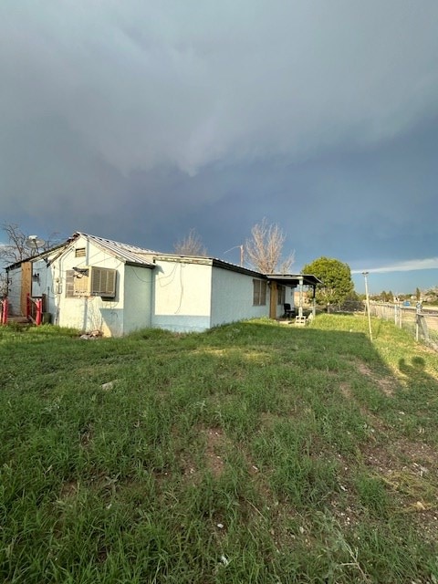 view of property exterior featuring a yard