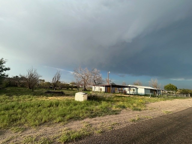 view of yard with a rural view