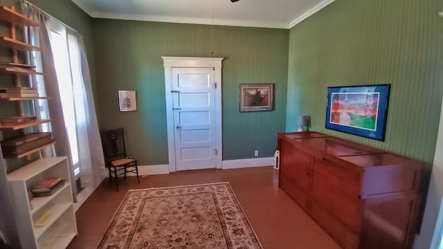 interior space featuring dark hardwood / wood-style flooring and crown molding