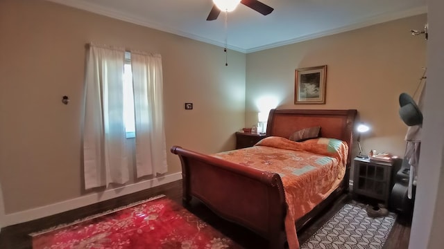 bedroom with dark hardwood / wood-style floors, ceiling fan, and ornamental molding