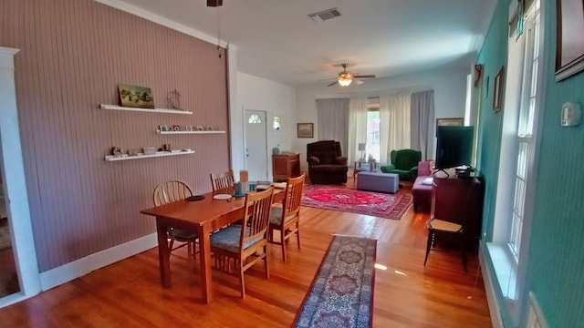 dining space featuring ceiling fan and wood-type flooring