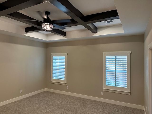 carpeted empty room with beam ceiling, ceiling fan, and coffered ceiling