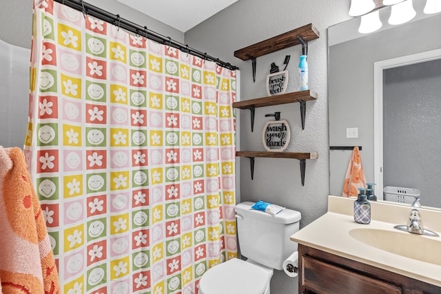 bathroom with vanity, a shower with shower curtain, a textured ceiling, and toilet