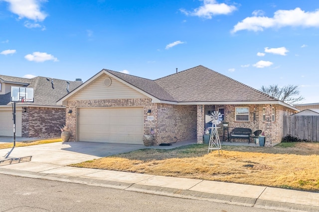 ranch-style house featuring a garage and a front lawn