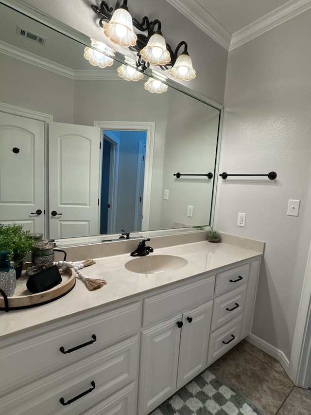 bathroom featuring tile patterned floors, vanity, ornamental molding, and a notable chandelier