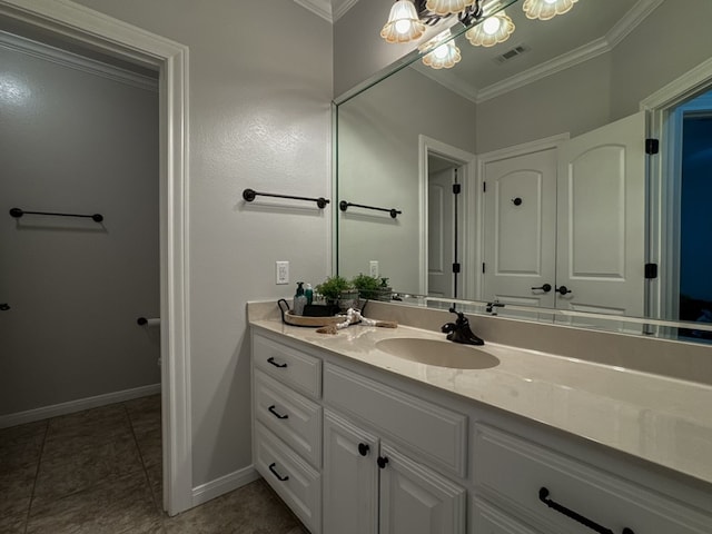 bathroom featuring vanity, tile patterned floors, and crown molding