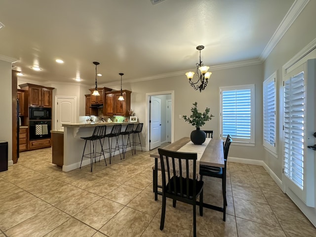 tiled dining area featuring a notable chandelier and ornamental molding