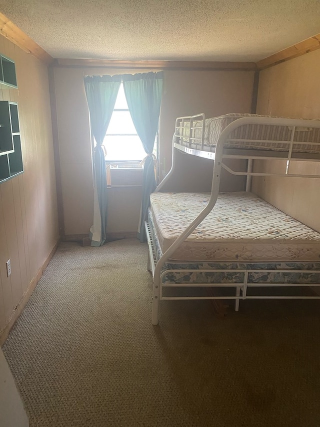 unfurnished bedroom with carpet floors and a textured ceiling