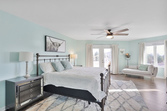 bedroom with wood finished floors, baseboards, ceiling fan, french doors, and access to outside