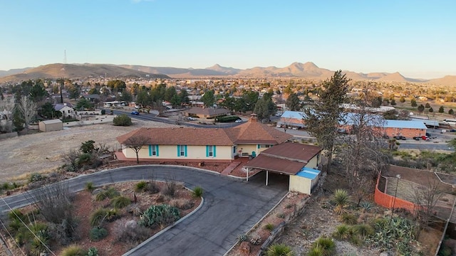 birds eye view of property featuring a mountain view and a residential view