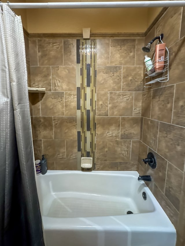 bathroom with shower / tub combo