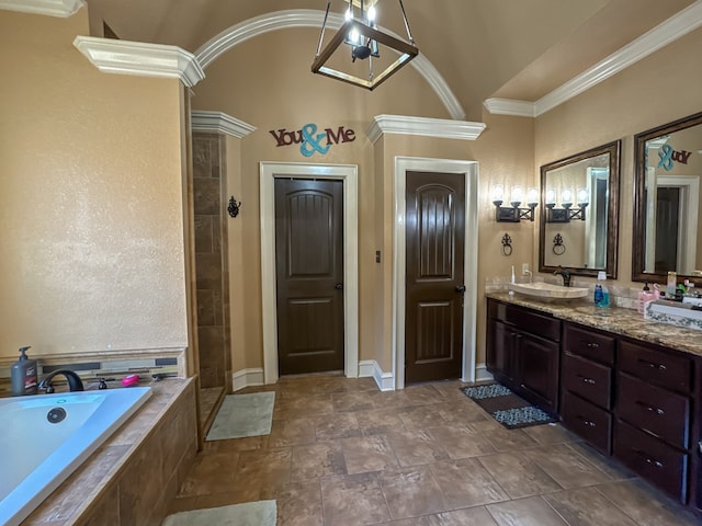 bathroom with ornamental molding, plus walk in shower, and vanity