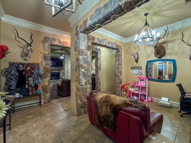 interior space with ornamental molding, a fireplace, and ceiling fan with notable chandelier