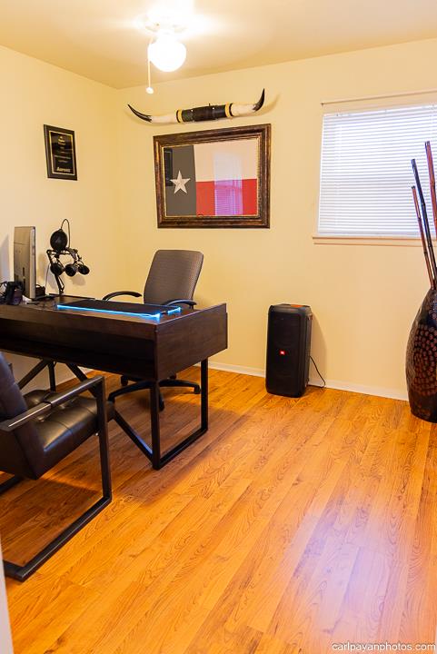 home office with light hardwood / wood-style floors