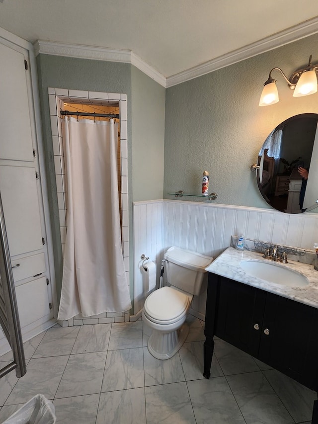 bathroom featuring crown molding, toilet, vanity, and a shower with shower curtain