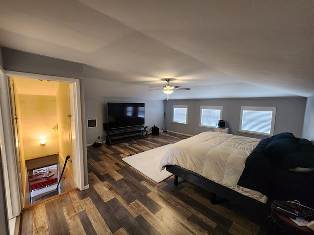 bedroom featuring ceiling fan and dark wood-type flooring