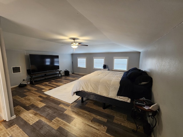 bedroom with ceiling fan and wood-type flooring