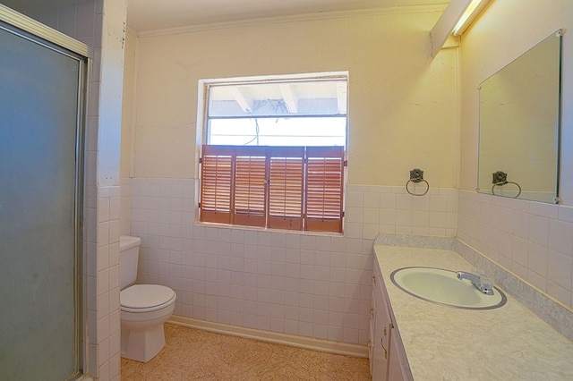 bathroom featuring walk in shower, ornamental molding, vanity, tile walls, and toilet