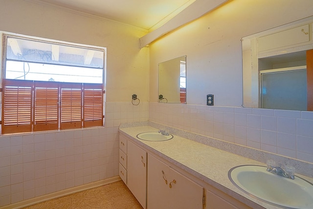 bathroom featuring vanity, tile walls, and ornamental molding