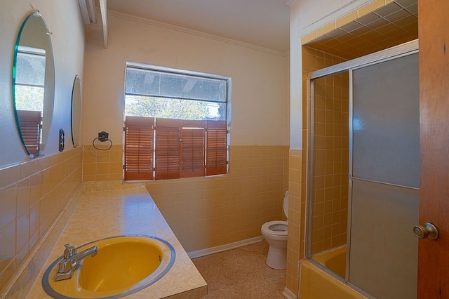 full bathroom with vanity, toilet, ornamental molding, and tile walls