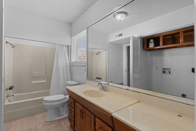 full bathroom with vanity, tile patterned flooring, toilet, shower / bath combo with shower curtain, and a textured ceiling