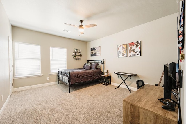 bedroom featuring carpet floors, visible vents, baseboards, and a ceiling fan