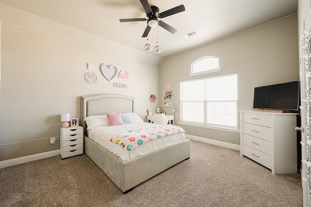 bedroom with baseboards, visible vents, ceiling fan, and light colored carpet