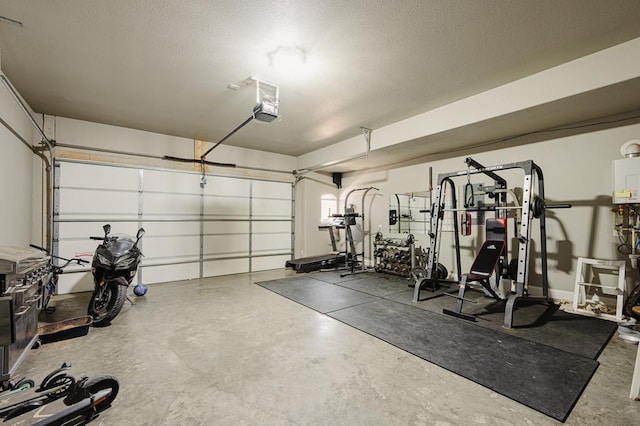 workout room featuring a garage and a textured ceiling