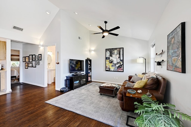 living room with ceiling fan, dark hardwood / wood-style flooring, and high vaulted ceiling