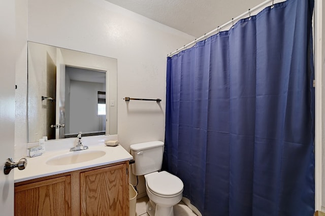 bathroom featuring curtained shower, tile patterned floors, a textured ceiling, toilet, and vanity